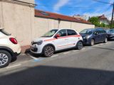 many cars parked on the side of the road