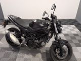 a picture of a motorcycle parked on a checkered floor