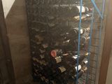 many bottles of wine on the rack in the room