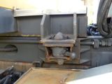 a close up of a truck ' s front end with a hose attached to it