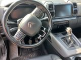 a picture of a car dashboard with a steering wheel