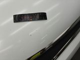 a close up of a sticker on the hood of a car