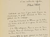 an old black and white photo of a handwritten letter on a piece of paper