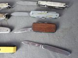 many different types of knives on the table
