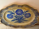 a blue and white plate with flowers on it
