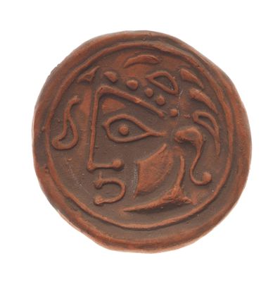 une image d'une pièce de monnaie sur laquelle figure un visage