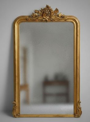 a mirror that is sitting on the wall in the room
