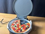 a pizza that is sitting on top of a pizza pan