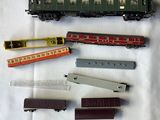 five different types of toy trains sitting on a table