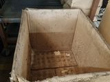 a box that is sitting in the middle of a pile of boxes