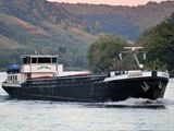 a boat that is traveling down the water