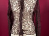 a mannequin with a black lace top on a mannequin mannequin