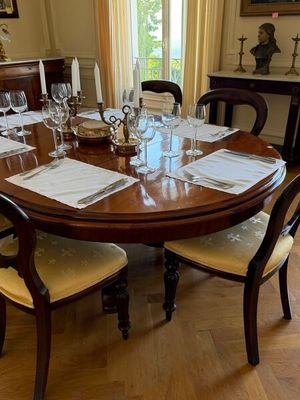 a table set for a formal dinner in the dining room