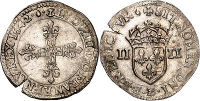 une pièce d'argent représentant une couronne au recto et un bouclier au verso