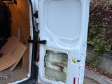 a white van with a door open in a parking lot