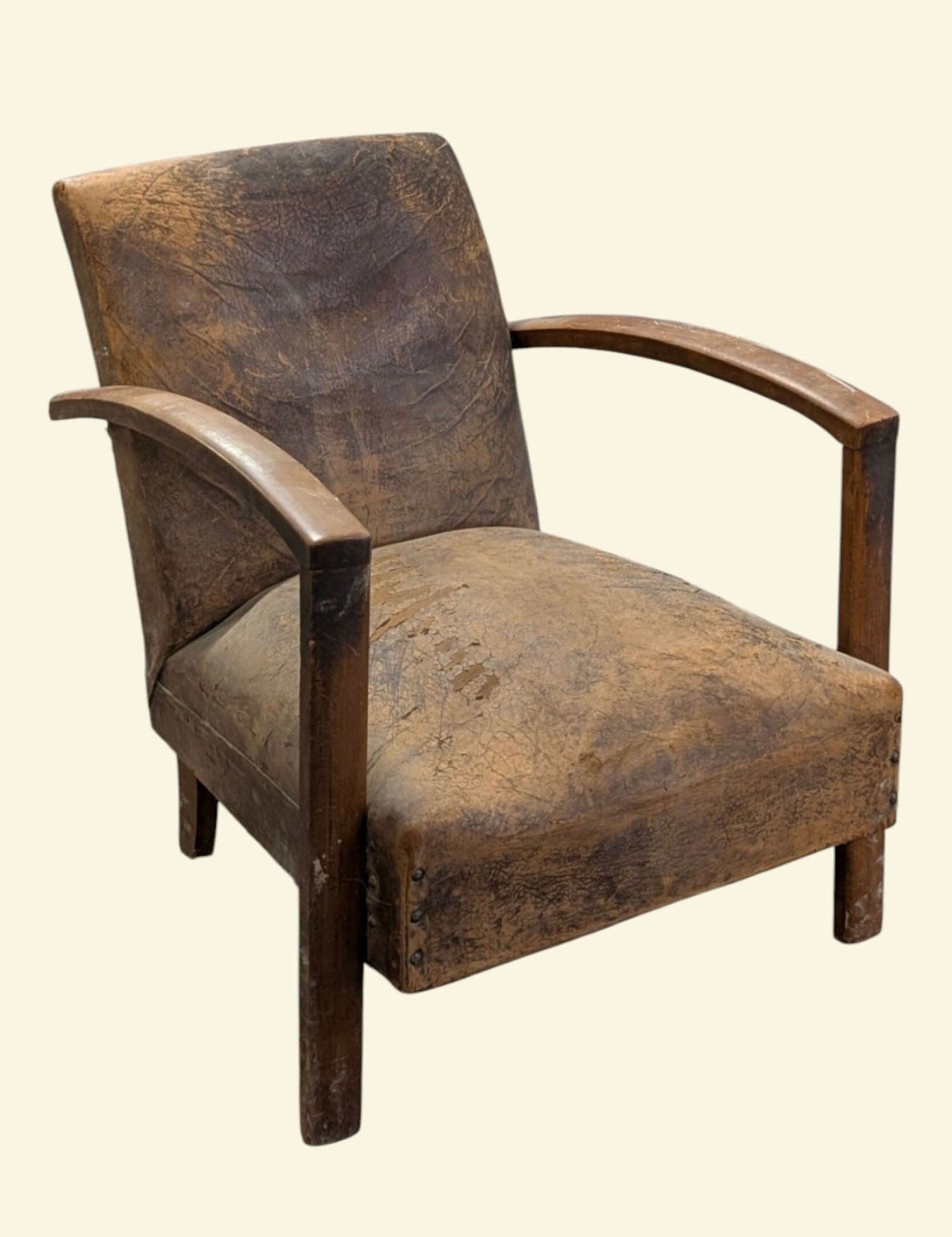 Fauteuil Club en cuir naturel couleur havane présentant un h…