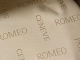 a white plate with writing on it sitting on a table