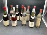 several bottles of wine are lined up in a row on a table