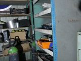 a room with a lot of shelves and a sign on the wall