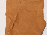 an image of a pair of brown pants on a white surface