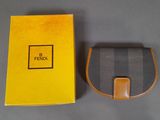 a close up of a wallet with a box on a table