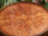 a wooden table with a floral design on it