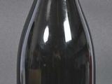 a bottle of wine that is sitting on a table