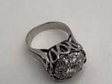 a close up of a silver ring on a white surface