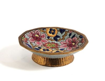 a small bowl that has a flower design on it