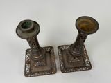 pair of antique brass candlesticks with green glass