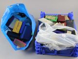 a plastic container filled with assorted items on a table
