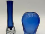 two vases sitting next to each other on a table
