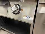 a silver oven with a black knob on it