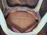 a deer ' s antlers on the back of a chair