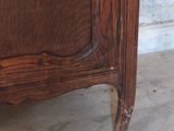 a wooden cabinet with a mirror on top of it