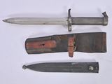 three different types of knives on a white surface