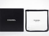 chanel perfume bottle in a black box on a white background