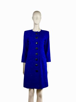 the mannequin is wearing a blue coat and black shoes