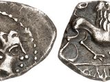 a close up of a coin with a bird on it