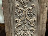 a wooden door with a carved design on it