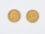 two gold sovereigns, one with the head of a man and one with a woman