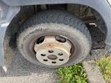 a close up of a flat tire on a car