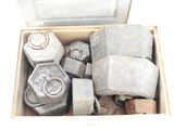 a box full of cement blocks and nuts in it