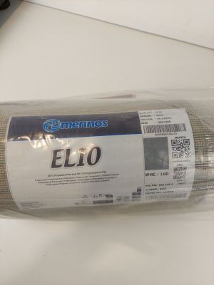 a roll of cloth on a table next to a pair of scissors