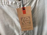 the back of a pair of khaki pants with a tag on it