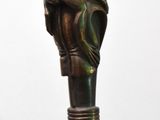 a close up of a cane with a hand on it