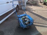 a blue lawn mower that is sitting on the ground