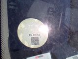 a sticker on the windshield of a car with a qr code on it