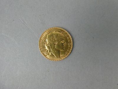 a gold coin with a picture of a woman on it