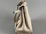 the back view of a handbag with a strap and a shoulder strap